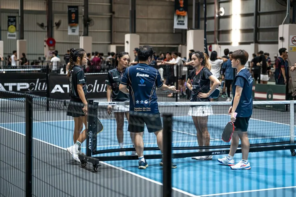 Players chatting courtside at ATP Club